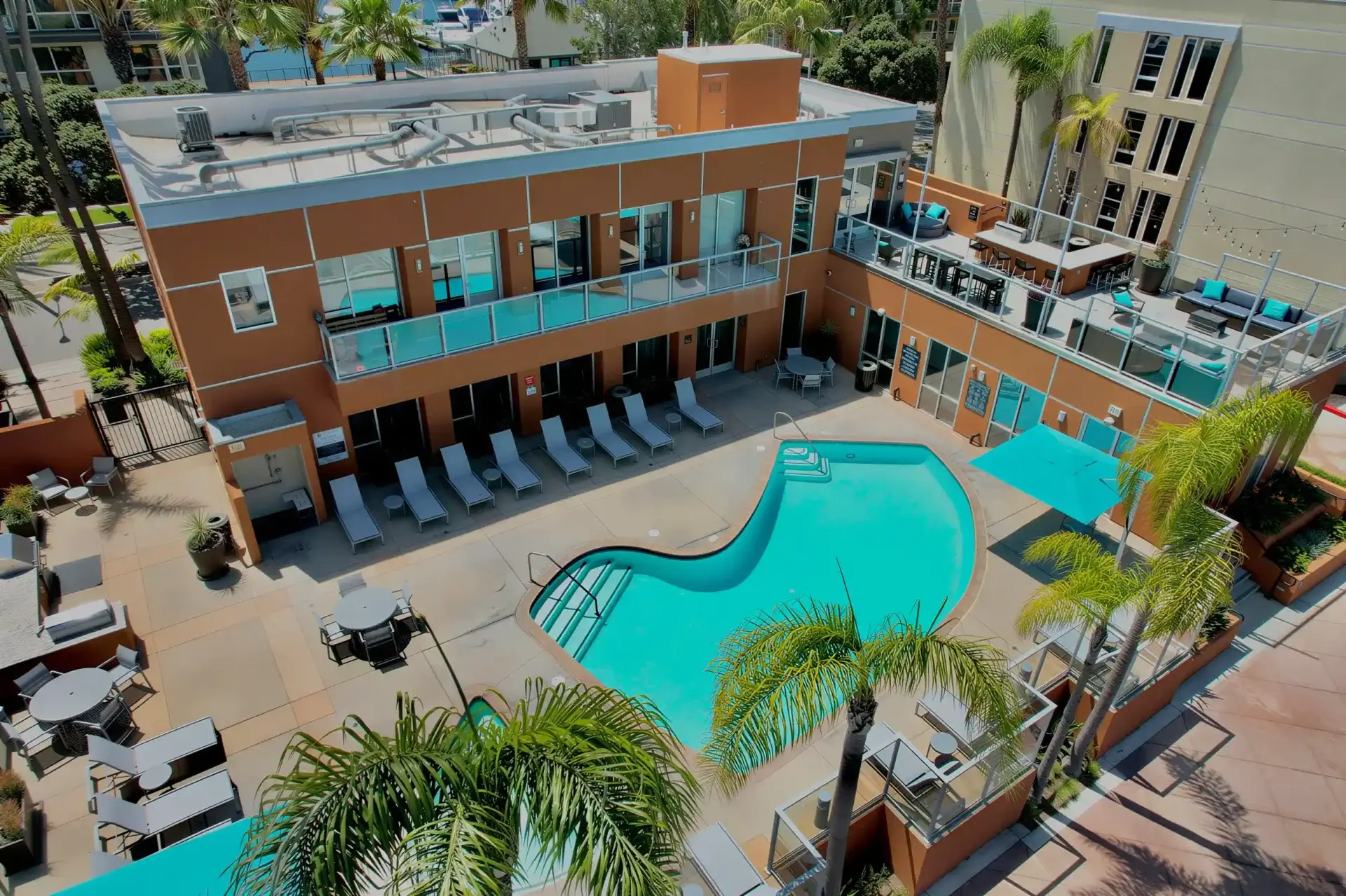 Resort-style pool and sundeck at Harborside Marina Bay apartments in Marina del Rey, California